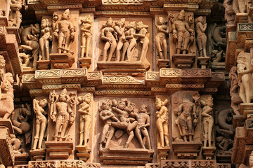 Close up of artful carved walls, Ancient reliefs at famous erotic temple in Khajuraho, Madhya Pradesh, India.