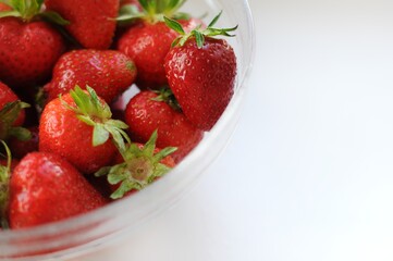 Strawberries in a bowl. Close up view. Summer vitamin fruits 