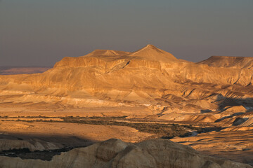 Fototapeta na wymiar View of Nahal Zin, a 120 km long intermittent stream, the largest canyon in country, as seen at sunset from Sde Boker field school, Negev desert, Israel.