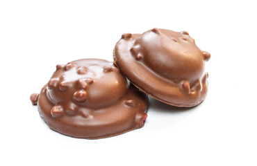 Chocolate covered biscuits filled with tasty jelly and fruit pieces. Snack isolated on white background