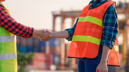 Engineering joins hand in business in industrial port background