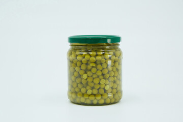Canned green peas on a white background. Food for salads, supplies for the long term. Food for donations
