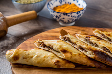 Traditional turkish baked dish pide. Turkish pizza pide, Middle eastern appetizers. Turkish cuisine. Top view. Pide with meat filling.