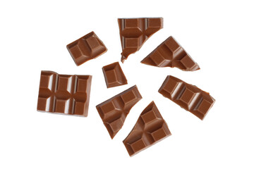 Pieces of milk chocolate isolated on white background and assorted.