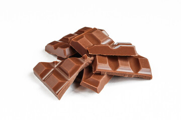 Pieces of milk chocolate isolated on white background and assorted.
