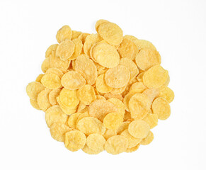 Pile of yellow cornflakes isolated on white background. Delicious dry cereals