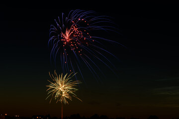 fireworks exploding in the city sky