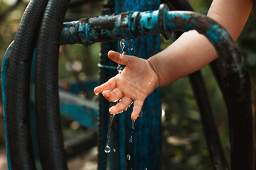 
small hand under the tap
