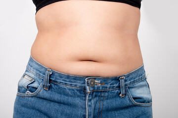 Young women have too much belly fat. She is losing weight.