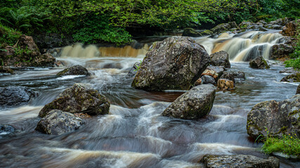 Small waterfalls on Kirk Burn running through Campsie Glen just above Clachan of Campsie nr Lennoxtown Scotland.