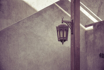 An old style arabian vintage light on the lamp post. Grunge middle eastern interior details.