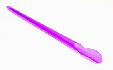 Purple plastic straw isolated on white background