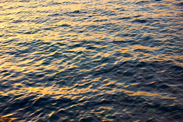 Sea water surface at sunset