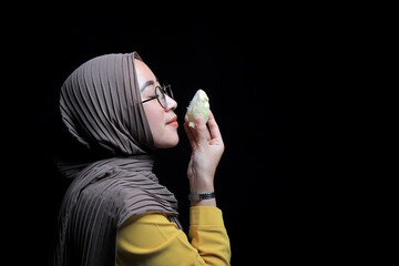 Asian woman poses to kiss durian fruit