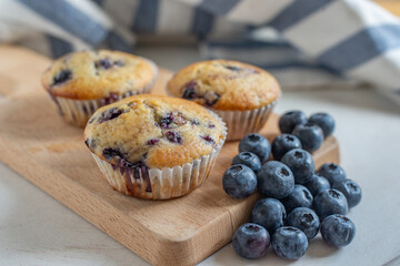 home made sweet vanilla blueberry muffins on a table