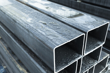 Stack of rolled metal products, wet steel pipes