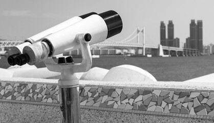 Binocular telescope on a rotating base