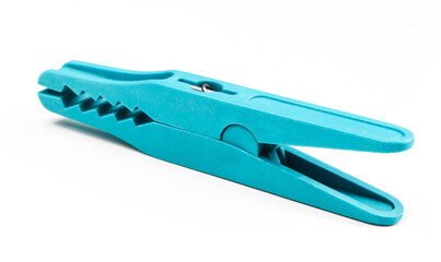 Blue clothespin isolated on white. Used clothes clamp close up