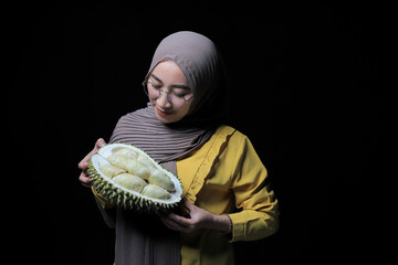 Asia woman holding durian fruit