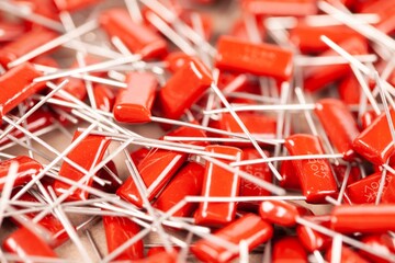 Close-up of a bunch of red capacitors