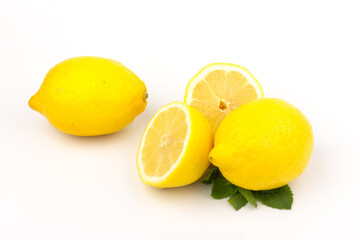 Group of lemons with mint leaves, isolated on white background