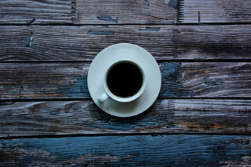 
Coffee cup on a blue old wooden background