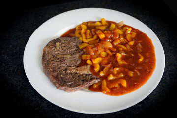 fresh cooking at home and ready to eat - grilled steak with a handmade spicy grill sauce