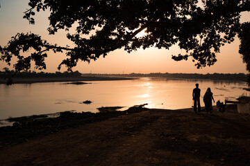 Sunset view of holy river Narmada at Neelkanth Ghat, Madhya Pradesh, India.