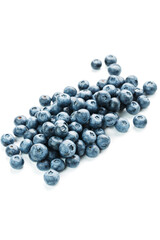 Blueberries isolated on a white background. A scattering of ripe, juicy, delicious and healthy berries.