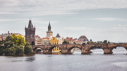 Charles Bridge, Prague famous landmark, color toning applied, Czech Republic.