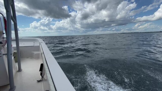 FPV side of boat going across choppy ocean waters