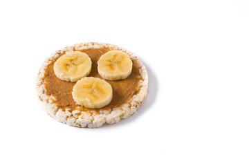 Puffed rice cake with banana and peanut butter isolated on white background.Copy space