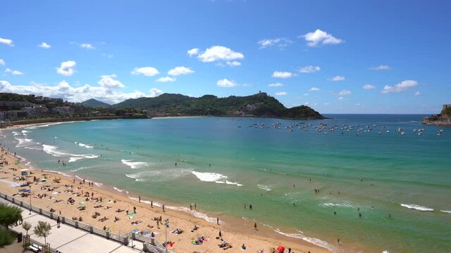 La Concha beach in the city of San Sebastian, Basque Country seen from above, drone view. Donostia. Gipuzkoa, Spain. 4k video. Also views of Mount Igeldo and Santa Clara Island