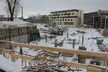 Fototapeta na wymiar Foundation poles of the new building in winter
