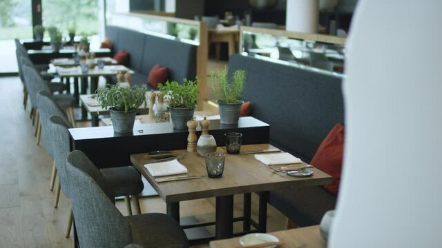 set tables interior of a modern restaurant 4K ProRes Footage