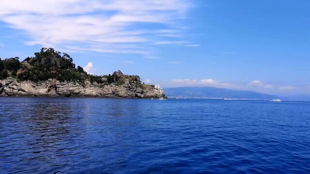 timelapse taken from a boat while sailing around the Portofino lighthouse