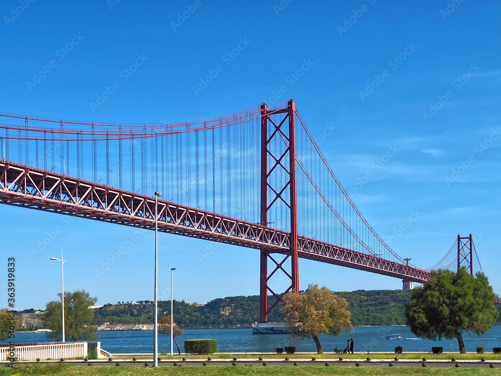 Wall mural seagull flying over red bridge ponte 25 de abril