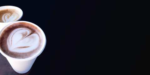 two cups of coffee cappuccino and latte art