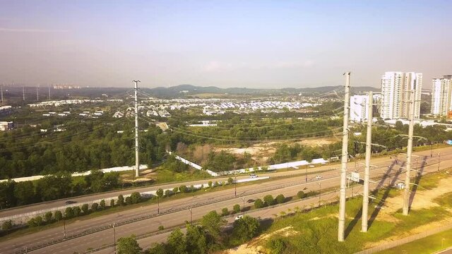 Aerial shot of power lines over highway  Malaysia