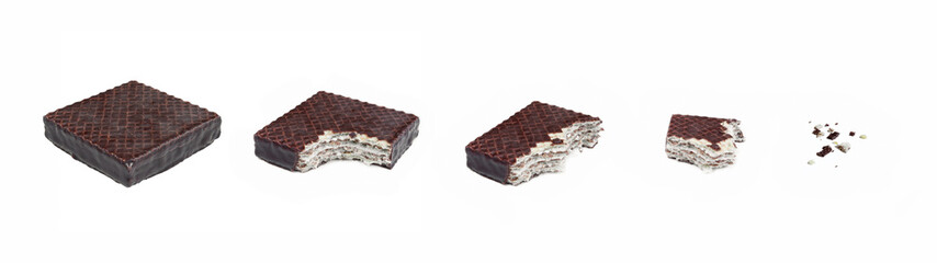 Chocolate covered wafer snack bites. Eating process/progression. Isolated on white background. 