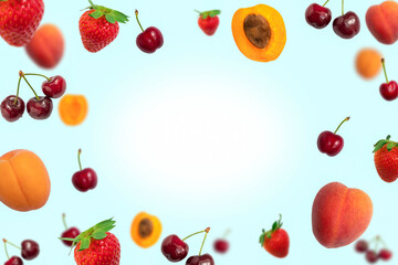 Background with flying ripe summer fruits frame on light blue background with copy space
