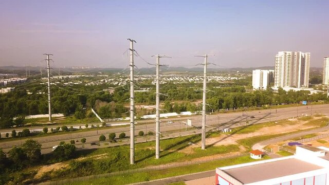 Aerial shot of power lines over highway  Malaysia