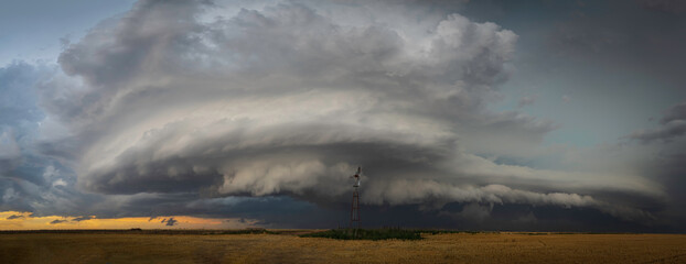Windmills on the Great Plains as Storms Approach