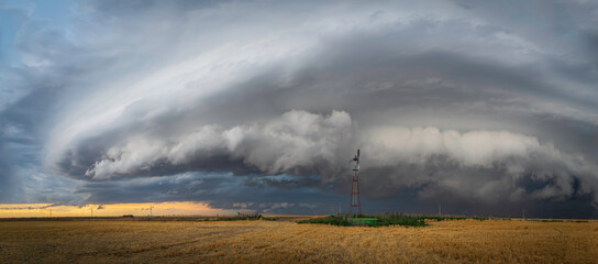 Naklejka na ściany i meble Windmills on the Great Plains as Storms Approach