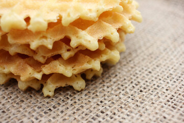 Close-up of Waffles on a burlap fabric texture background. Top view, copy space