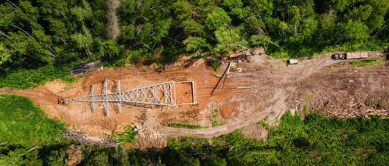 Construction of power lines in the forest