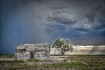 Old, Abandoned Structures on the Great Plains as Storms Approach