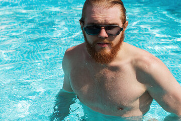 Summer Man Body Sun Skin Care. Beautiful Model With Sexy Body In Swimwear Tanning, 