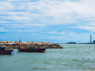 A fishing boat floating on the sea, complete with fishing equipment