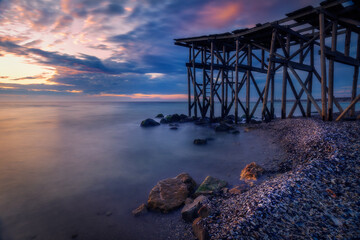 A beautiful long exposure shot of a sunrise or sunset by the sea